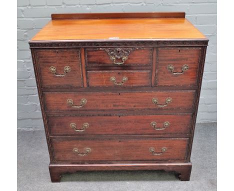 'Waring &amp; Gillow', an early 20th century mahogany Scottish style chest of four short over three long graduated drawers, o