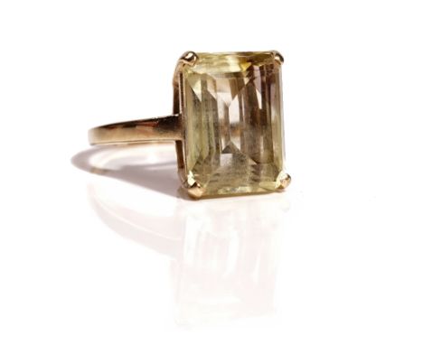 A 9ct gold ring, claw set with a rectangular step cut citrine, ring size P, gross weight 7.3 gms.