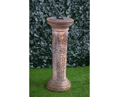 A terracotta sundial with wriggle work column on stepped base, 38cm diameter x 105cm high. 