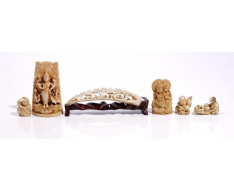 A group of Asian ivory carvings, 19th/early 20th century, comprising; a Canton ivory tusk, carved and pierced with figures, b