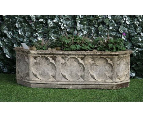 A reconstituted stone Gothic Revival garden planter, of pointed rectangular form, 88cm wide x 28cm high.