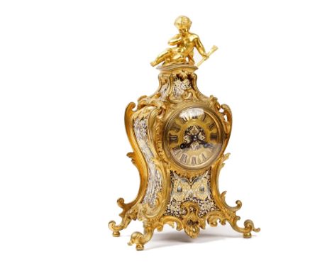 A French gilt metal and champlevé enamel mantel clock in Louis XV style, circa 1870, the shaped case surmounted by a cherub w