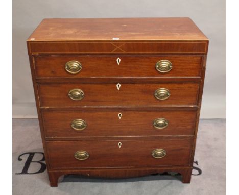 A George III inlaid mahogany chest of four long graduated drawers on bracket feet. 