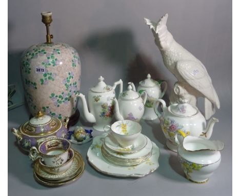 Ceramics; a large white glazed model of a parrot, a ceramic table lamp and a group of decorative tea wares (qty). 