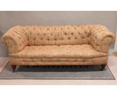 A late Victorian mahogany framed Chesterfield sofa with button back upholstery on ring turned supports, 200cm wide x 70cm hig