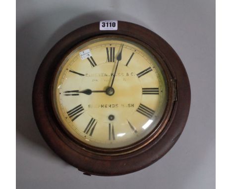 An early 20th century German circular wall clock, one key and one pendulum, 27cm diameter. 