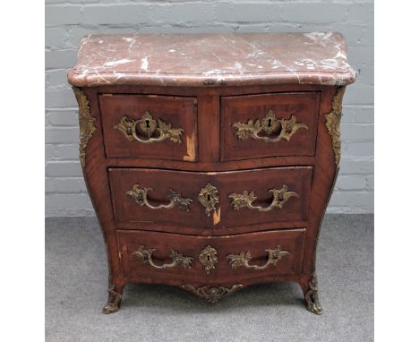 An 18th century French gilt metal mounted Kingwood commode, the marble top over a serpentine base, with two short and two lon