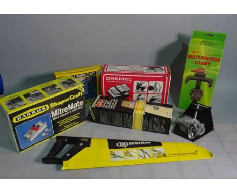 Tools; a quantity including electric meters, hammers, a bench clamp and sundry.  