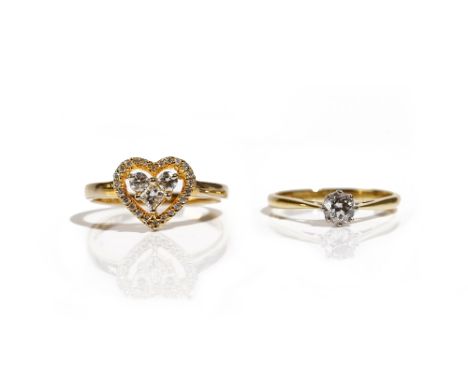 A gold and diamond set heart shaped cluster ring, mounted with a princess cut diamond, two principal circular cut diamonds an