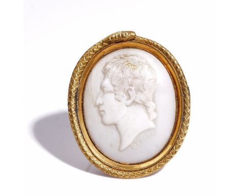 A Victorian oval shell cameo brooch, carved as the portrait of a gentleman, detailed BANKES, the setting designed as a coiled