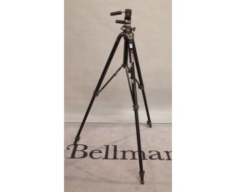 A mid 20th century ManFrotto professional camera tripod, 96cm tall.