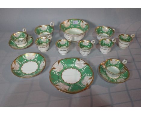 A 19th century porcelain part tea service green decoration and gilt border. 