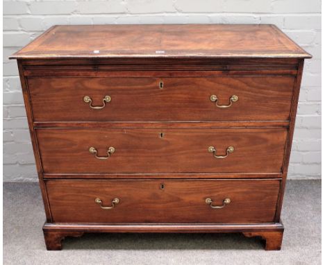 A George III mahogany chest, the brushing slide over three long graduated drawers on bracket feet, 110cm wide x 93cm high.