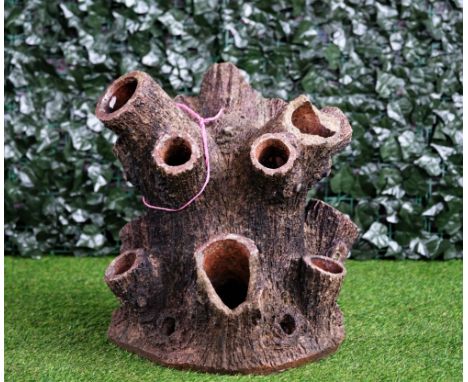 A terracotta strawberry planter of naturalistic tree trunk form, 53cm high. 