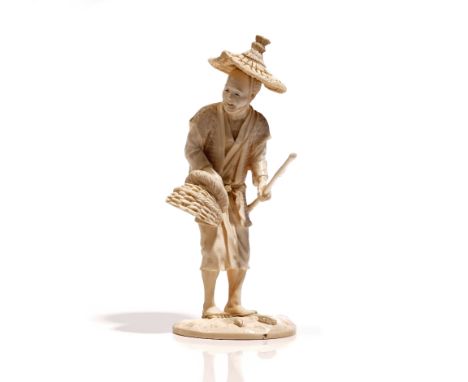 A Japanese ivory okimono of a fisherman, Meiji / Taisho period, carved standing holding a basket and stick, signed, 18.5cm. h