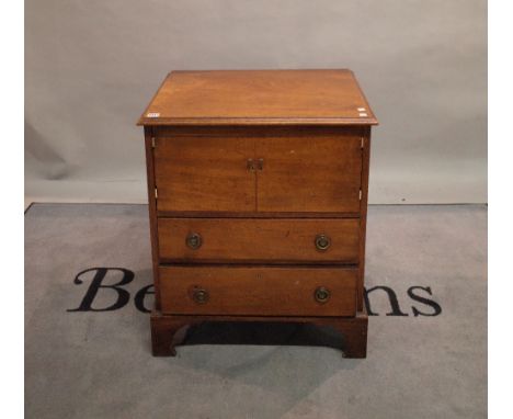 A late George III mahogany commode chest over two drawers on bracket feet, 64cm wide x 75cm high. 