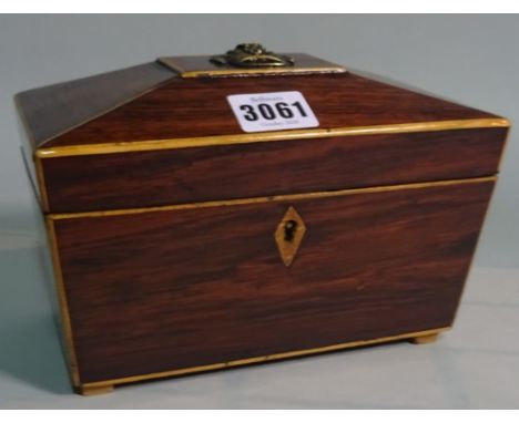 An early 20th century rosewood inlaid tea caddy of sarcophagus form, 20cm wide x 21cm high
