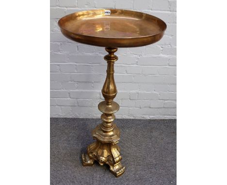 A 19th century lacquered brass alter candlestick, with a later dish top, 94cm high. 