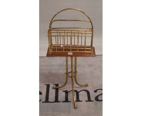 A late Victorian mahogany brass magazine rack with two divisions on tubular tripod base, 36cm wide x 14cm deep x 79cm high.