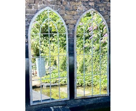 ARCHITECTURAL WALL MIRRORS, a pair, 160cm high, 67cm wide, Gothic arched design, aged metal frames. (2) 