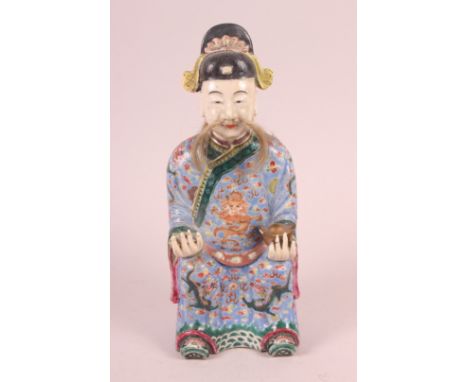 A Canton enamel figure of the God of Fortune, 10" high (restorations)Condition: One hand and right ear has been replaced, hea