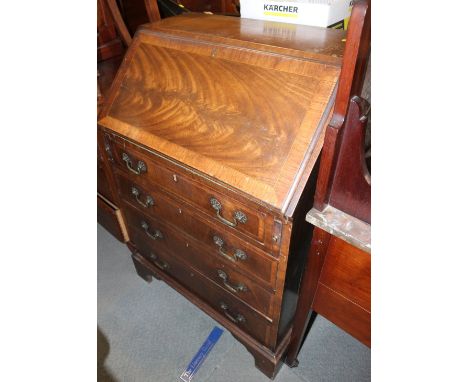 A walnut and banded fall front bureau with shaped fitted interior over four long drawers, on bracket feet, 27" wide x 19" dee