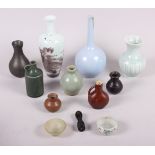 A pale blue sprinkler vase, 7 1/2" high, a similar vase with dragon decoration, four other