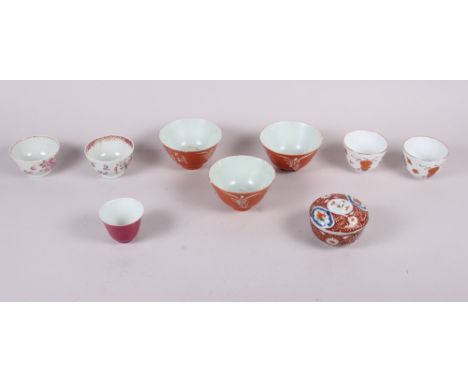 Three Chinese orange glazed tea bowls with seal marks to base, two pairs of tea bowls, and another tea bowl and cover  Condit