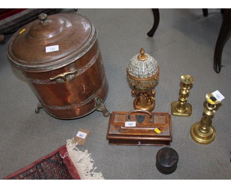 A copper two-handled container with matched cover, 16" high, two brass candlesticks, an oak desk tidy and a table lamp 