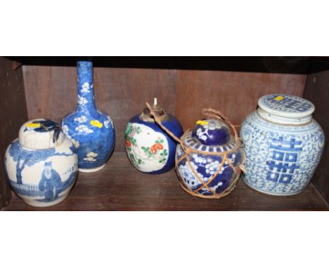 A Chinese blue and white ginger jar and cover, 7 1/2" high, two smaller ginger jars, a sprinkler bottle and a floral decorate