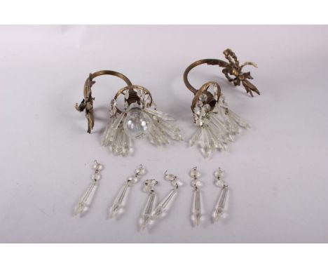 A pair of gilt brass single light wall brackets, point drops with ribbon backs, 7" high 