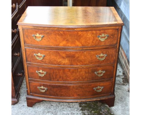 A figured and walnut banded bowfront chest of four long drawers, on bracket feet, 31" wide x 19" deep x 32" high 