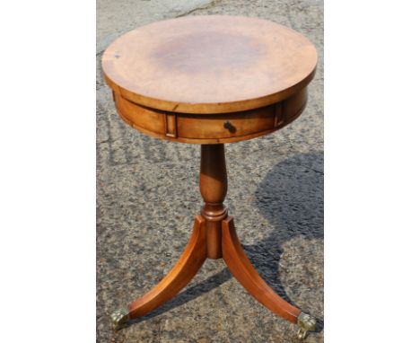 A Brights of Nettlebed burr walnut and banded circular top drum table, fitted two drawers, on tripod splay supports, 15" dia 