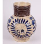 An early 18th century German stoneware jug with GR monogram, 5" high (restored)