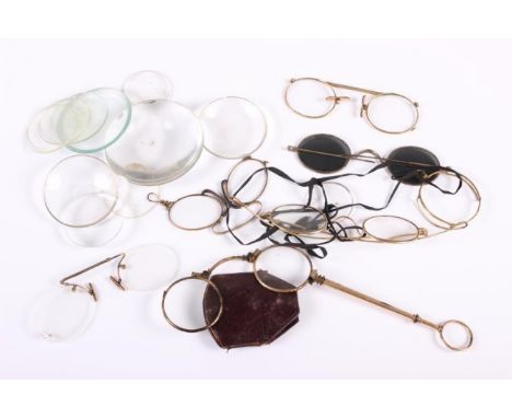 A gold plated lorgnette and various spectacles, lenses, pocket watch glasses, together with a number of propelling pencils, d