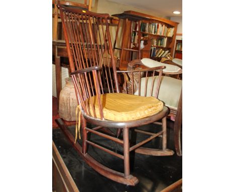 A modern stick back rocking chair and a mahogany wine table, 16" dia 