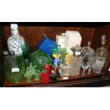 A Murano glass clown and a quantity of green coloured glass