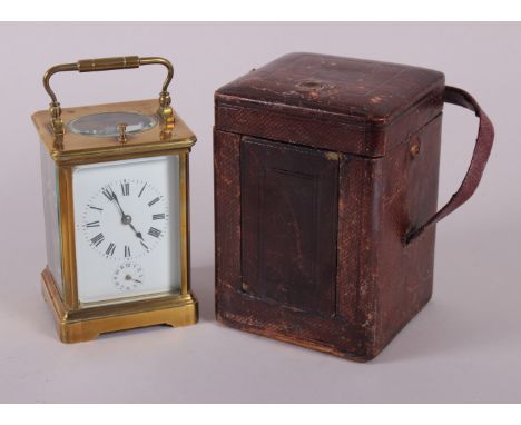 A late 19th century brass cased carriage clock with quarter repeat strike movement and alarm, 5 1/2" high, in fitted case 