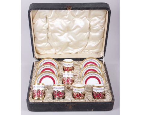 A cased set of six Cauldron bone china coffee cans with silver gilt mounts and six matching saucers Condition: One cup has mi