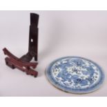 A Chinese blue and white circular ceramic panel, decorated Dogs of Fo, 18" dia, with carved hardwood