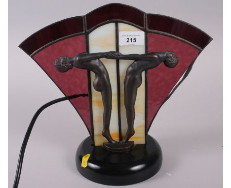 An Art Deco design lamp with athletes and glass panel, 11" high 