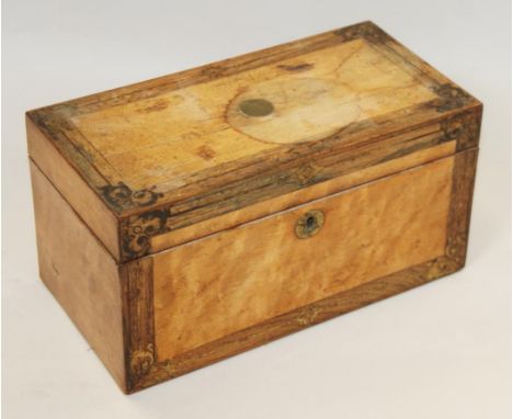 An early 19th century satinwood and rosewood banded tea caddy with gilt decoration and brass mounts, fitted Bristol blue glas