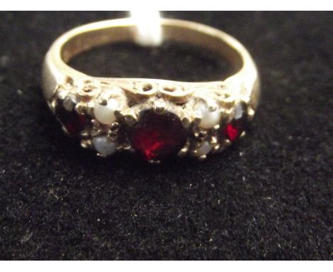 9ct gold dress ring with garnets and seed pearls. Size R