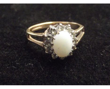 9ct gold dress ring with central opal. Size J