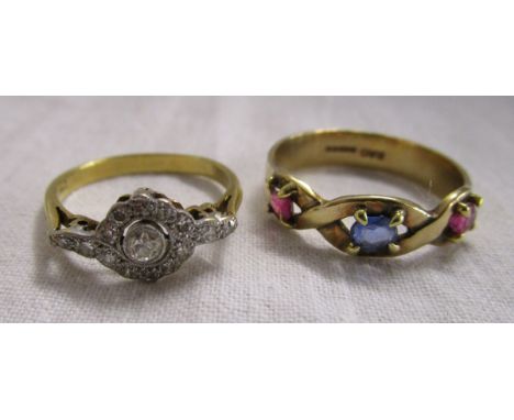 Gold stone set ring together with an 18ct gold diamond daisy ring.The diamond daisy set ring is k½ & and the multi coloured s