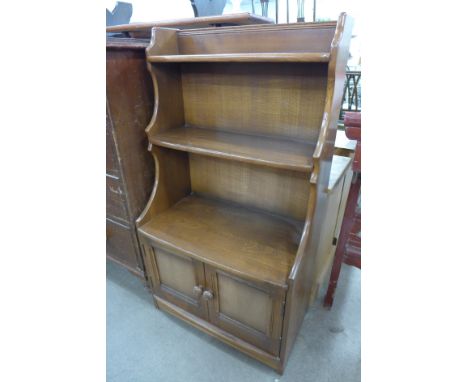 An Ercol two door open bookcase