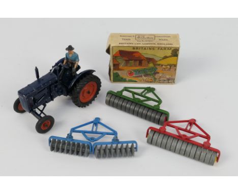 Britains - An unboxed Fordson Major Tractor # 128F with a farmer figure, a boxed Roller # 136F, an unboxed Roller # 136F and 