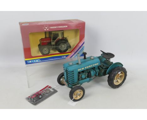 Ertl - Universal Hobbies - A boxed Massey Ferguson 3050 tractor in 1:32 scale # 1139, a carded Massey Ferguson 135 tractor ke