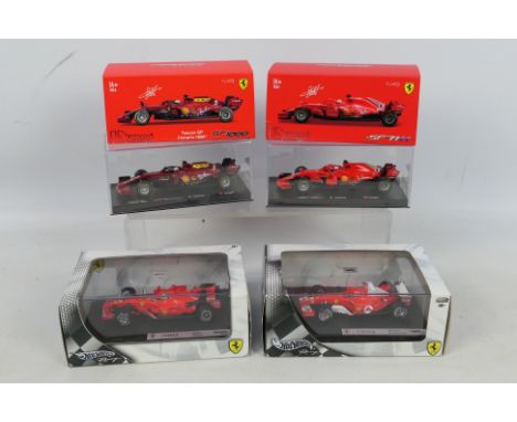 Hot Wheels - Bburago 4 x boxed F1 models in 1:43 scale , F2004 Michael Schumacher car # B6206, F2007 Felipe Massa # K5435, SF