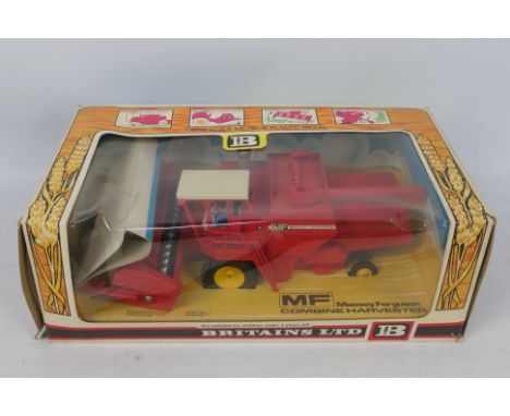 Britains - A boxed 1970s Massey Ferguson 760 Combine Harvester # 9750 in 1:32 scale. The model appears Mint in a Good box wit